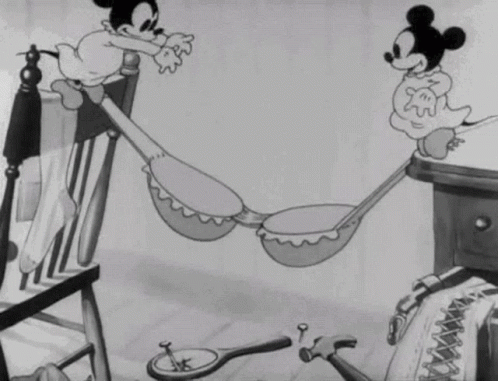 Mickey Mouse and Minnie Mouse Laying in Hammocks