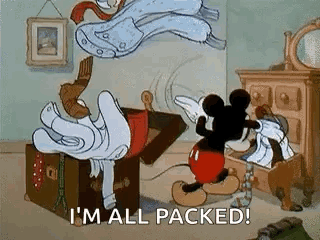 Mickey Mouse Is Standing Next To A Trunk Filled With Clothes And Saying `` I 'M All Packed ! '' GIF