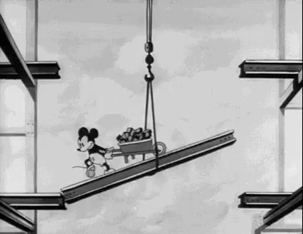 Mickey Mouse Riding Crane on Metal Beam