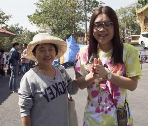 Mickey Mouse Shirt Woman and Older Woman Hat