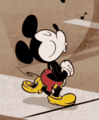 Mickey Mouse Walking Down Sidewalk GIF