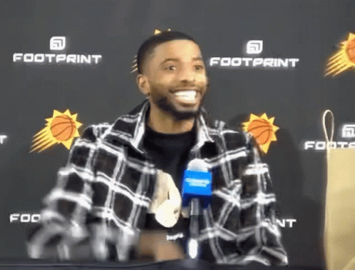 Mikal Bridges Interview Waving Big Smile GIF