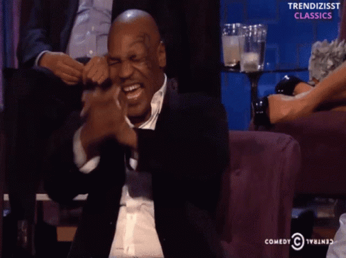 Mike Tyson Laughs in Front of Comedy Central Logo