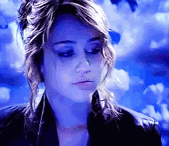 Miley Cyrus Throwing Rose Flower GIF