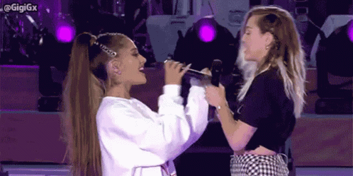 Miley Cyrus Embraces Ariana Grande GIF