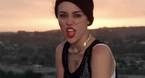 Miley Cyrus Playing With Tongue GIF