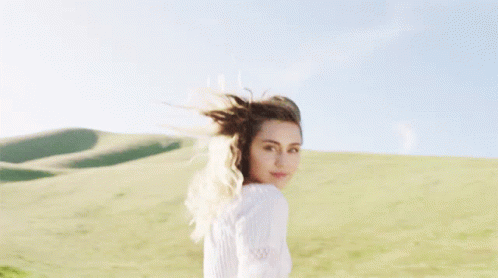Miley Cyrus In White Dress GIF