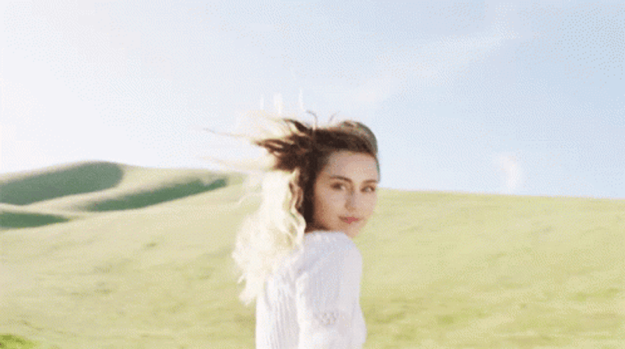 Miley Cyrus In White Dress GIF