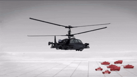 Military Helicopter Flying Over Red Tanks GIF