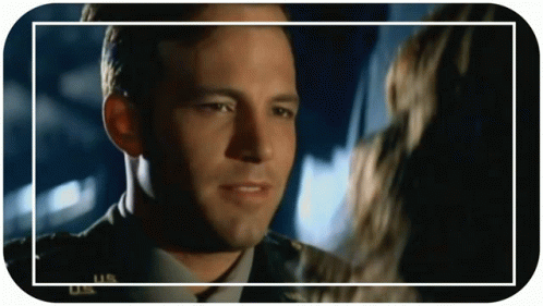 Military Man Looking At Woman In Frame GIF