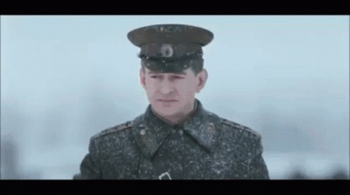 Military Uniform Man Looking at Camera Snow