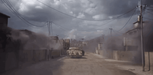 Military Vehicle Driving On Dirt Road Under Cloudy Sky GIF