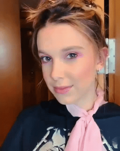 Millie Bobby Brown Wearing Pink Scarf GIF