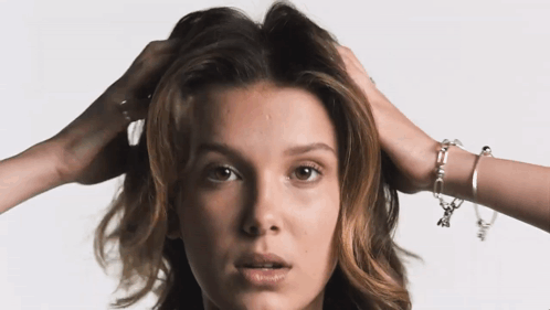 Millie Bobby Brown Scrunching Hair GIF