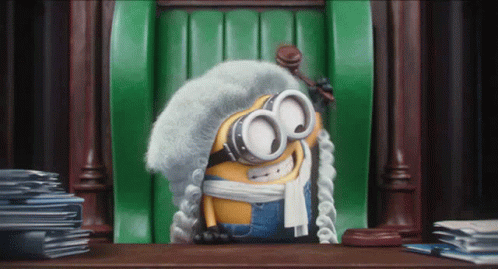 Minion Wearing Wig and Goggles Sitting