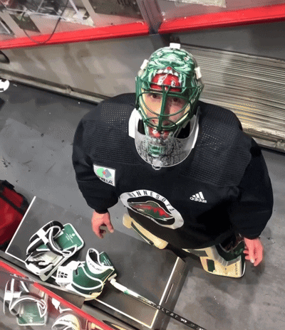 Minnesota Hockey Player Sitting on Ice