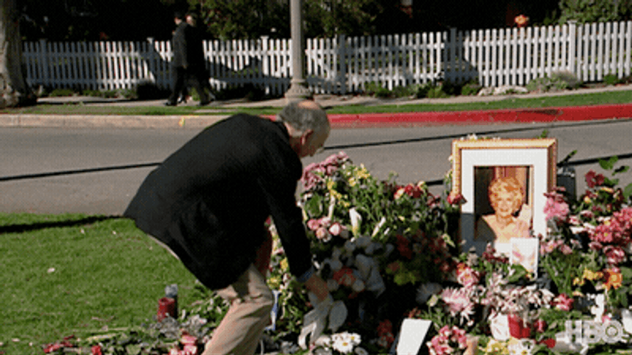 Mischievous Guy Stealing Flower From Funeral GIF