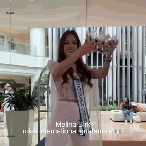 Miss International Guatemala Melina Birk Holding Crown