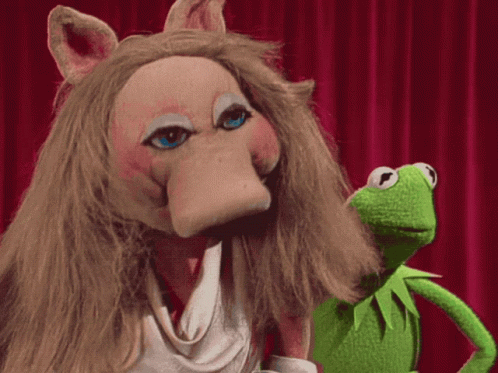 Miss Piggy And Kermit Standing On Stage GIF