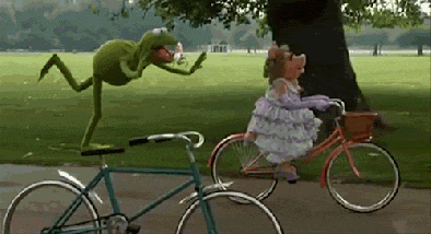 Miss Piggy Riding A Bicycle GIF
