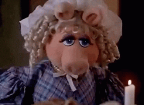 Miss Piggy Sitting At Table With Candle GIF