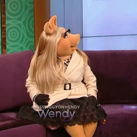 Miss Piggy Sitting on Couch Legs Crossed