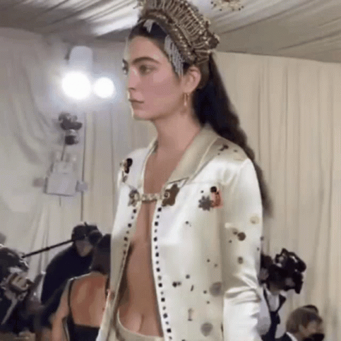 Model Walking Runway in Crown and Revealing Jacket