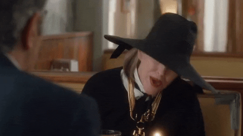 Moira Rose Blowing Candle GIF