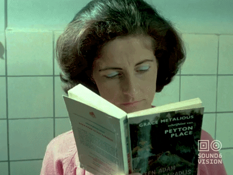 Mom Multitasking Reading And Cooking GIF
