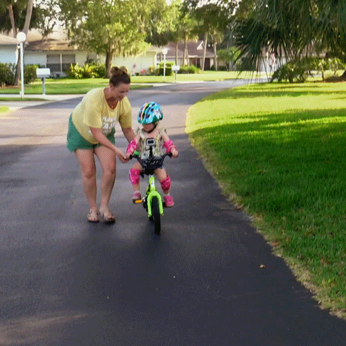 Mom Teaching Her Kid Riding Bike GIF