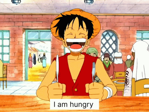 Monkey D Luffy Is Holding A Knife And Fork With A Sign That Says I Am Hungry GIF