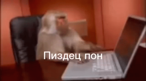 Monkey Sitting at Desk With Laptop