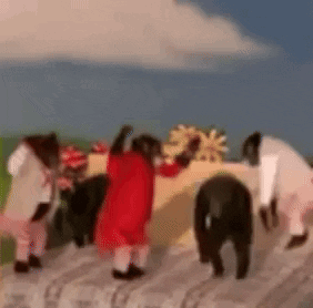 Monkeys Dressed as Santa Claus Standing on Log