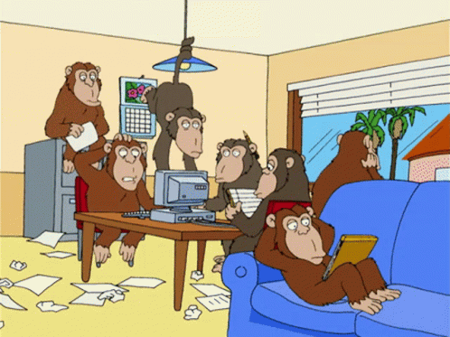 Monkeys Gathered Around Computer