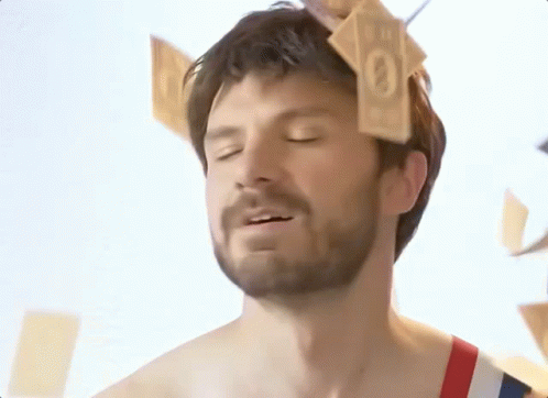 Monopoly Money Falling Above Man GIF