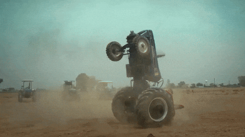 Monster Truck Doing Trick on Dirt Road
