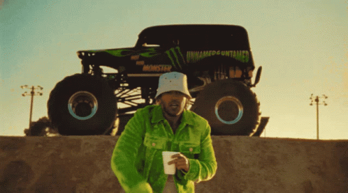 Monster Truck on Dirt Track with Toughest Sign
