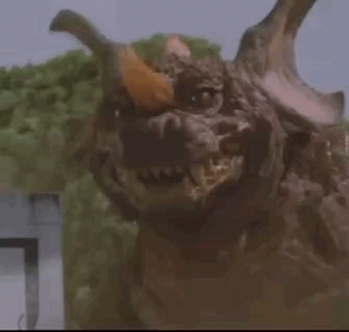 Monster With Horns Looking at Camera in Trees