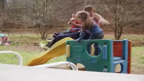 Mother And Kids Falling Down On Little Slide GIF