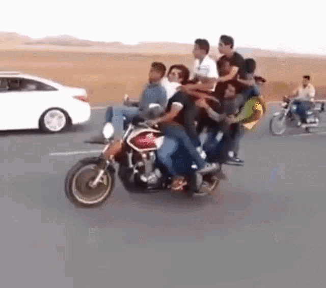 Motorcycle Overloaded Seven People Stunt GIF