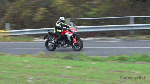 Motorcyclist Riding Red Motorcycle