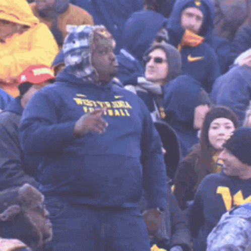 Mountaineers Fan Wearing Hood Cheering And Dancing GIF