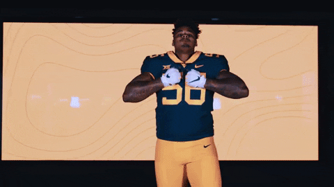 Mountaineers Player Posing With Confidence And Flexing GIF