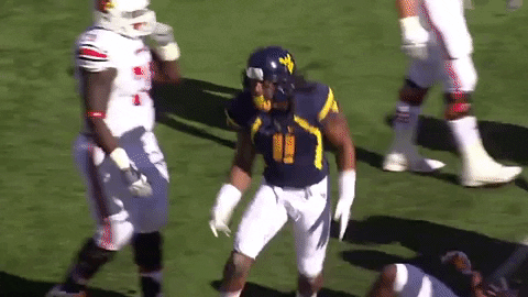 Mountaineers Players Doing Chest Bump GIF