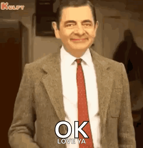 Mr Bean in Suit and Tie Smiling Saying Ok Love Ya