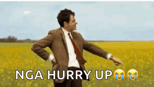 Mr Bean Is Dancing In A Field Of Yellow Flowers . GIF