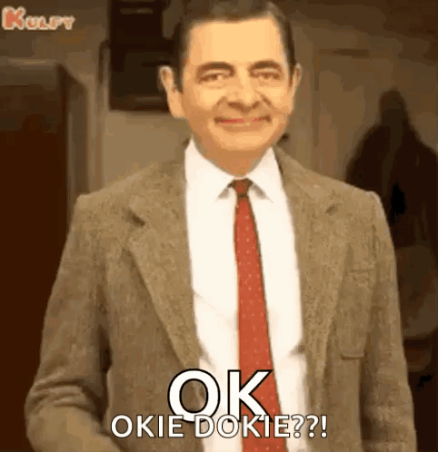 Mr Bean Is Wearing A Suit And Tie And Says `` Ok Okie Dokie ? '' GIF
