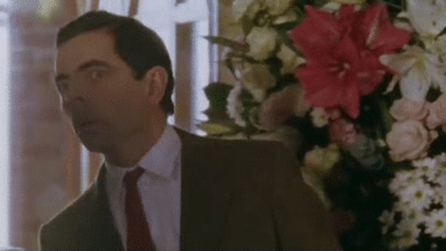 Mr. Bean Looking Around Searching GIF