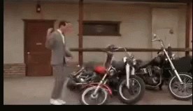 Mr. Bean Motorcycle Like Dominos Falling GIF