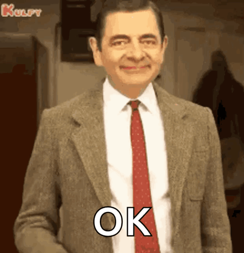 Mr Bean Smiling And Saying Ok GIF